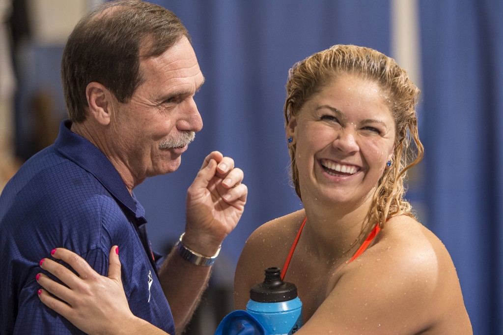 Coach Troy and Elizabeth Beisel enjoy talk before the first day preklims.
