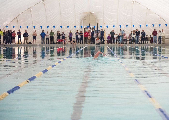 Lt. Shannon Scaff, an instructor at the Coast Guard Maritime Law Enforcement Academy in Charleston, S.C., takes the first lap of a long distance swim he dedicated to a fallen Coast Guard aircrew, Feb. 27, 2015. Scaff undertook the challenge of swimming in a local Charleston pool for 24 hours to bring awareness and support to the families of fallen military members. (U.S. Coast Guard photo by Petty Officer 1st Class Stephen Lehmann)
