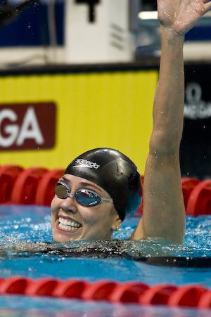 Natalie Coughlin wins 100 meter backstroke.