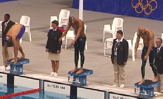 Ian Crocker, Michael Klim, and Geoff Hugill on the blocks for the 100 Fly final.