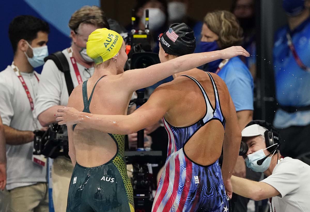 Jul 26, 2021; Tokyo, Japan; Ariarne Titmus (AUS) hugs Katie Ledecky (USA) after the women's 400m freestyle final during the Tokyo 2020 Olympic Summer Games at Tokyo Aquatics Centre. Mandatory Credit: Rob Schumacher-USA TODAY Sports