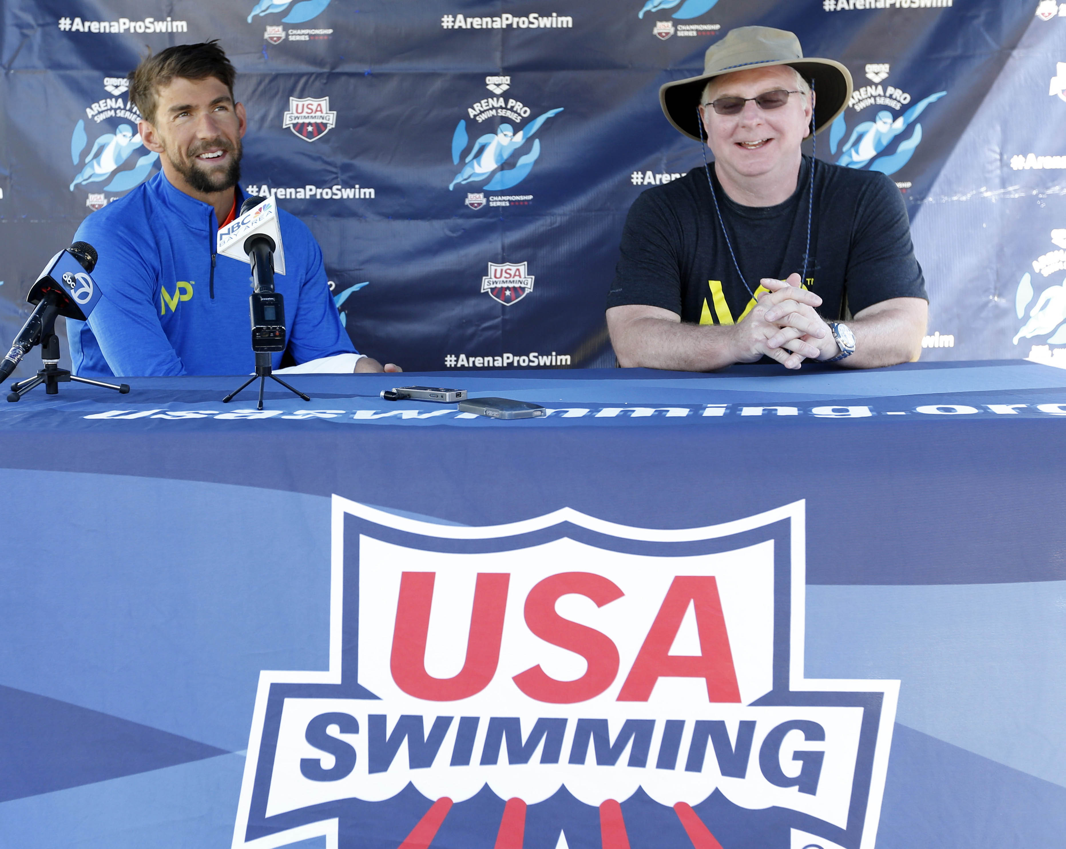 Jun 18, 2015; Santa Clara, CA, USA; Michael Phelps (USA) on left, and Bob Bowman head swimming coach of the Arizona State Sun Devils, answer questions during the morning press conference on day one of the Arena Pro Series at Santa Clara, at the George F. Haines International Swim Center in Santa Clara, Calif. Mandatory Credit: Bob Stanton-USA TODAY Sports