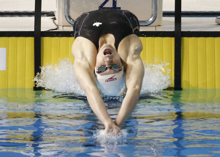 Jul 17, 2015; Toronto, Ontario, CAN; Dominique Bouchard of Canada competes in the women's swimming 100m backstroke preliminary heats during the 2015 Pan Am Games at Pan Am Aquatics UTS Centre and Field House. Mandatory Credit: Rob Schumacher-USA TODAY Sports