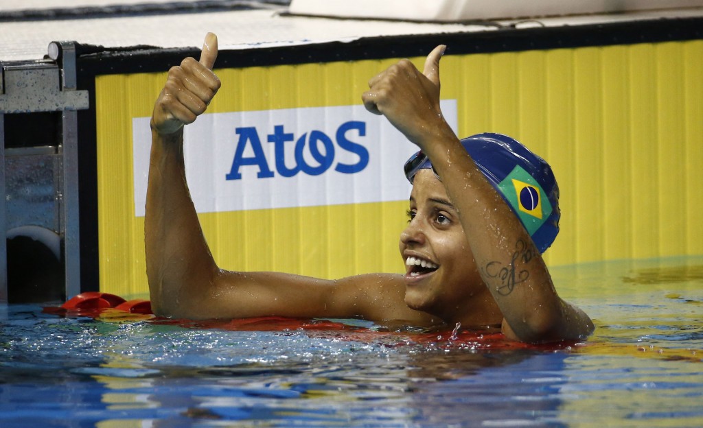 Jul 17, 2015; Toronto, Ontario, CAN; Etiene Medeiros of Brazil celebrates after winning the women's 100m backstroke final the 2015 Pan Am Games at Pan Am Aquatics UTS Centre and Field House. Mandatory Credit: Rob Schumacher-USA TODAY Sports