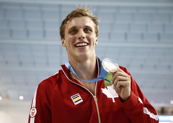 Jul 14, 2015; Toronto, Ontario, CAN; Santo Condorelli of Canada poses with his silver medal after the men's 100m freestyle swimming final during the 2015 Pan Am Games at Pan Am Aquatics UTS Centre and Field House. Mandatory Credit: Rob Schumacher-USA TODAY Sports