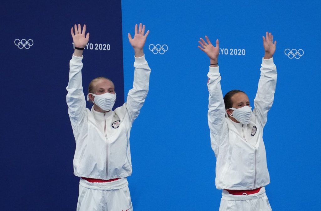 Jul 27, 2021; Tokyo, Japan; Jessica Parratto and Delaney Schnell (USA) celebrate their second place finish in the women's 10m platform synchronized diving competition during the Tokyo 2020 Olympic Summer Games at Tokyo Aquatics Centre. Mandatory Credit: Robert Hanashiro-USA TODAY Sports
