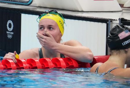 Jul 26, 2021; Tokyo, Japan; Ariarne Titmus (AUS) celebrates after finishing ahead of Katie Ledecky (USA) to win the women's 400m freestyle final during the Tokyo 2020 Olympic Summer Games at Tokyo Aquatics Centre. Mandatory Credit: Robert Hanashiro-USA TODAY Sports