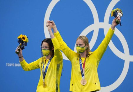 Jul 31, 2021; Tokyo, Japan; Kaylee McKeown (AUS) and Emily Seebohm (AUS) on the podium together with their medals during the medals ceremony for the women's 200m backstroke final during the Tokyo 2020 Olympic Summer Games at Tokyo Aquatics Centre. Mandatory Credit: Rob Schumacher-USA TODAY Sports
